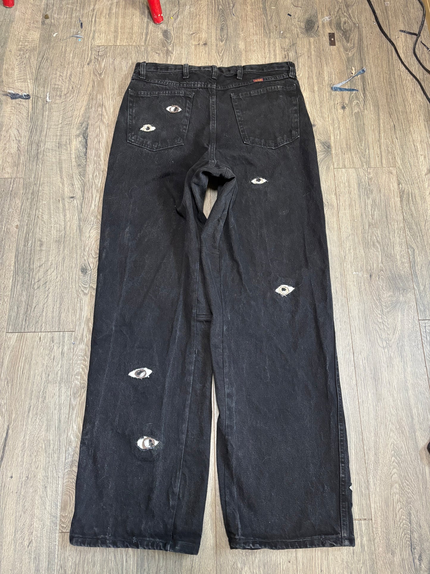 1 of 1 Black Eye denim pants.
